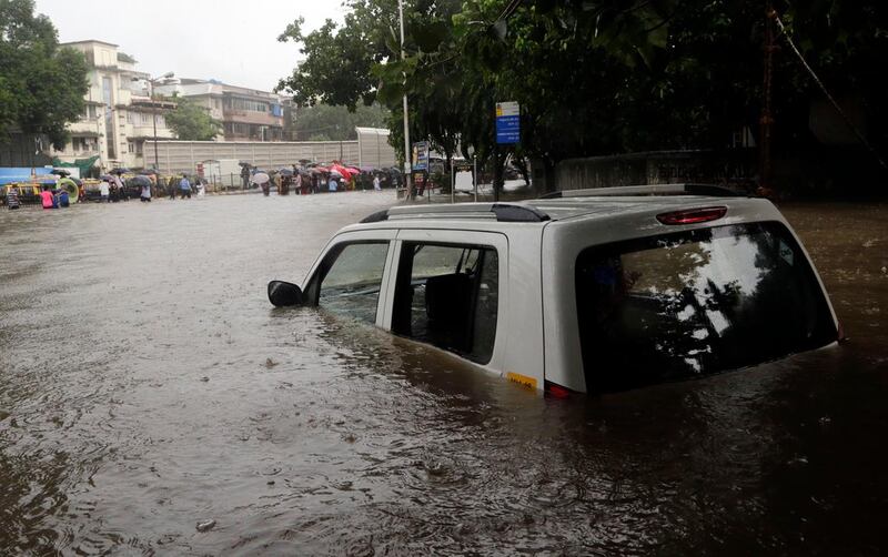 Rising waters in Mumbai which have devoured human beings as well as vehicles and buildings. Rajanish Kakade / AP Photo