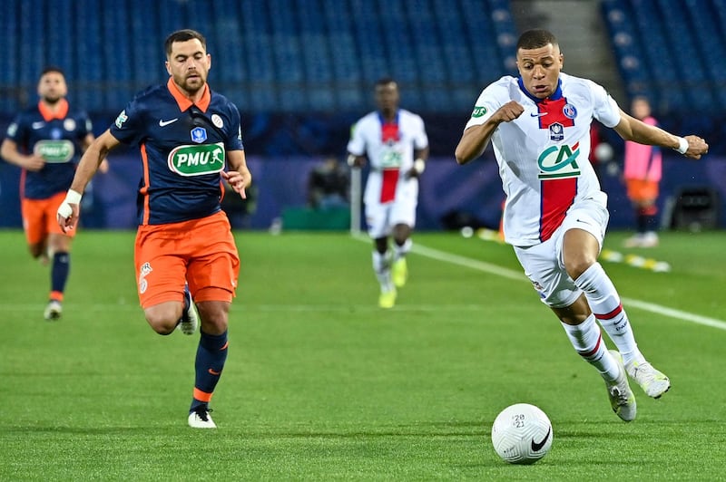 Paris Saint-Germain's French forward Kylian Mbappe runs with the ball. AFP