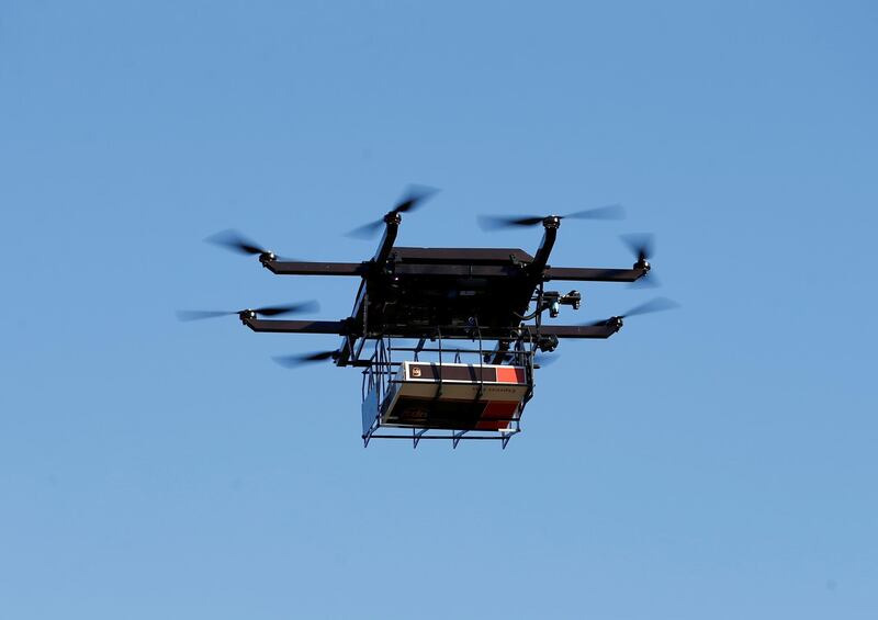 FILE PHOTO: A drone demonstrates delivery capabilities from the top of a UPS truck during testing in Lithia, Florida, U.S. February 20, 2017. REUTERS/Scott Audette/File Photo