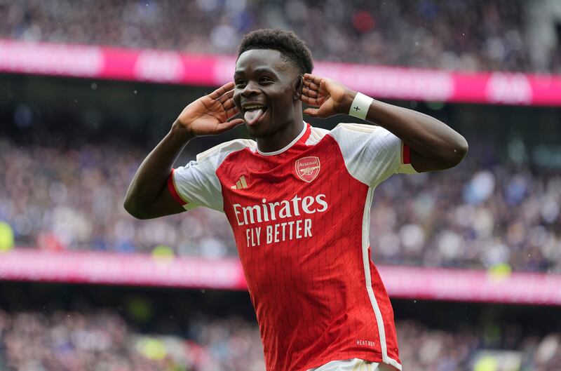 Arsenal's Bukayo Saka celebrates after scoring his side's second goal in the 3-2 Premier League victory against Tottenham Hotspur at the Tottenham Hotspur Stadium on Sunday, April 28, 2024. PA 