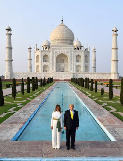 US President Donald Trump and First Lady Melania Trump pose as they visit the Taj Mahal in Agra on February 24, 2020. / AFP / Mandel NGAN
