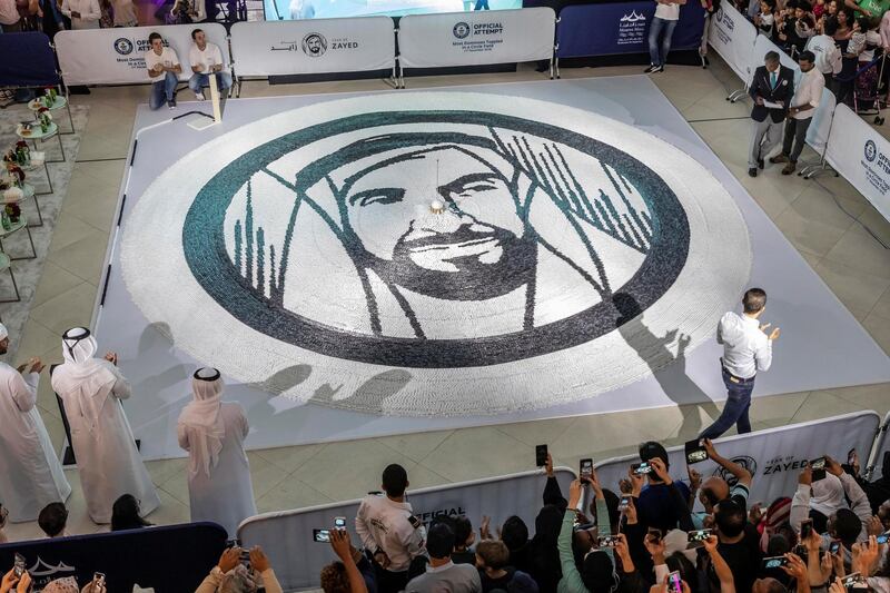 ABU DHABI, UNITED ARAB EMIRATES. 01 DECEMBER 2018. Succesfull World Record attempt for the most Domino���s toppled in a circular form. Shaped in a Year Of Zayed Sheikh Zayed portrait at Marina Mall. (Photo: Antonie Robertson/The National) Journalist: None. Section: National.