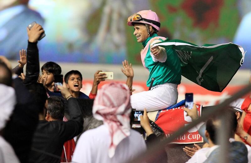 Jockey Mike Smith celebrates atop Arrogate following the main event of the Dubai World Cup at Meydan Racecourse in Dubai. Pawan Singh / The National