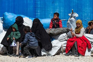 Syrian women and children wait to leave the Kurdish-run al-Hol camp in north-east Syria. AFP
