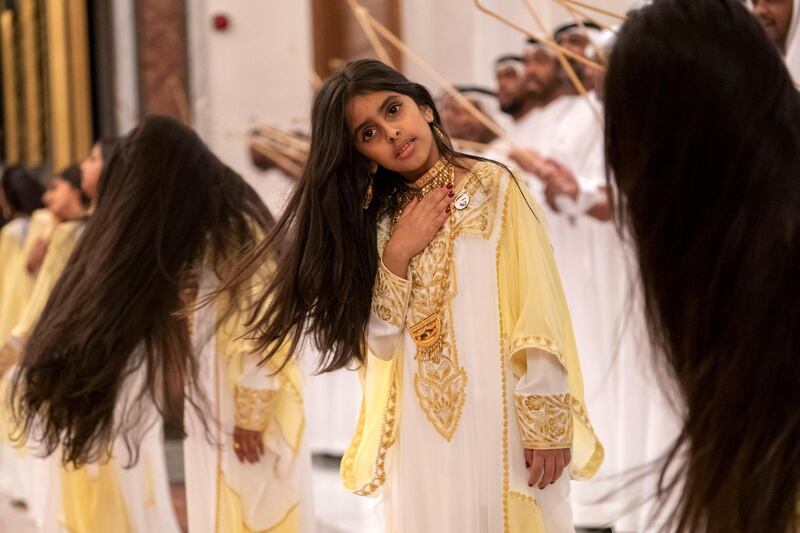 ABU DHABI, UNITED ARAB EMIRATES - February 3, 2019: Day one of the UAE papal visit - A children dance during arrival of His Holiness Pope Francis, Head of the Catholic Church (not shown), and His Eminence Dr Ahmad Al Tayyeb, Grand Imam of the Al Azhar Al Sharif (not shown), at the Presidential Airport. 

( Ryan Carter / Ministry of Presidential Affairs )
---