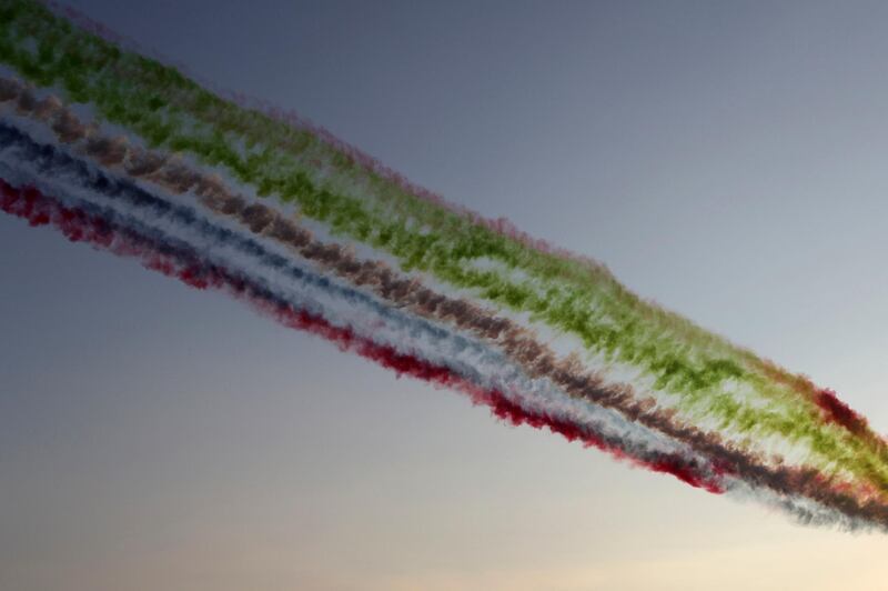 The UAE flag colours are spread by passing planes over the track. AP Photo
