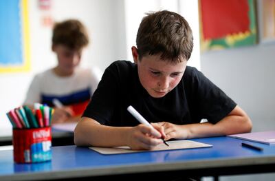 FILE PHOTO: A child sits in a classroom at Watlington Primary School during the last day of school, amid the coronavirus disease (COVID-19) outbreak, in Watlington , Britain, July 17, 2020. REUTERS/Eddie Keogh/File Photo