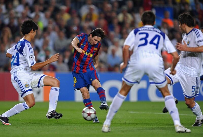 BARCELONA, SPAIN - SEPTEMBER 29:   Lionel Messi (2nd L) of Barcelona scores his sides opening goal past Leandro Almeida (L), Yevgen Khacheridi (2nd R) and Ognjen Vukojevic of Dynamo Kiev during the Champions League group F match between Barcelona and Dynamo Kiev at the Camp Nou Stadium on September 29, 2009 in Barcelona, Spain.  (Photo by Jasper Juinen/Getty Images)