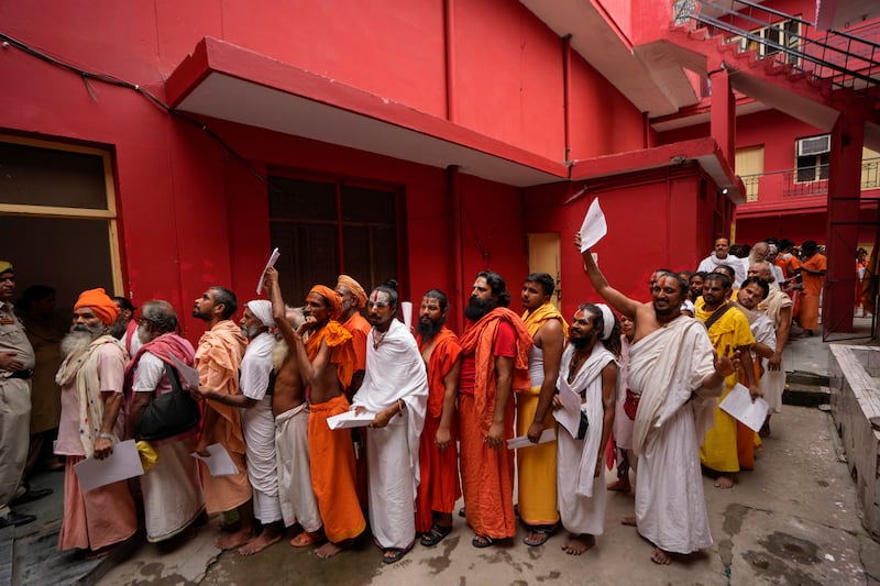 Hindu holy men stand in a queue in Jammu, India, to register for the annual pilgrimage to the Amarnath cave shrine. AP