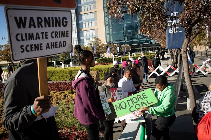 Activists in Johannesburg protest protest against corporate financing of fossil fuel projects, including the Ugandan pipeline. EPA
