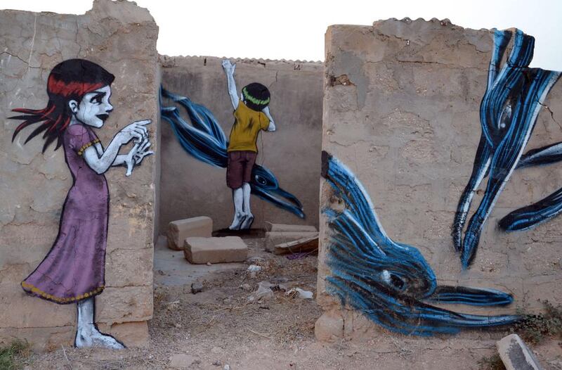 Graffiti decorates the walls of an abandoned building. F Nasri / AFP Photo