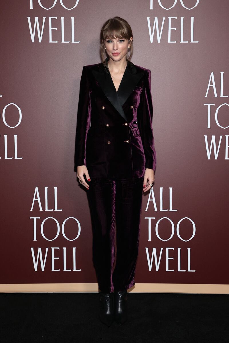 Taylor Swift, in a velvet Etro suit, attends the 'All Too Well' premiere in New York City on November 12, 2021. Getty