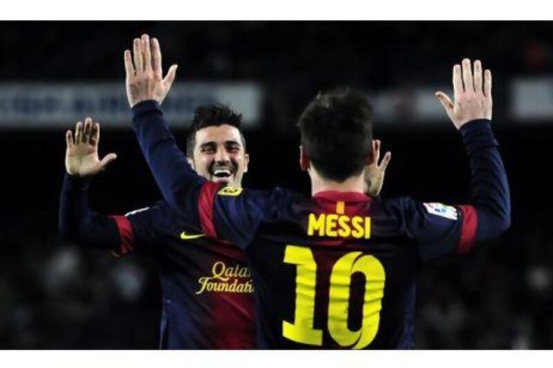 Villa, left, is back in favour at Barcelona, striking up a productive pairing with Messi. Manu Fernandez / AP Photo