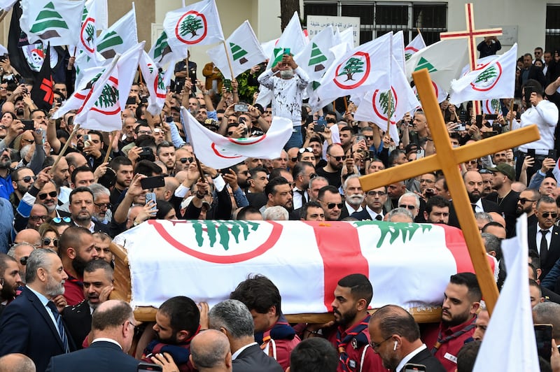Mourners carry the coffin of Pascal Sleiman, an official of the Lebanese Forces Christian party, during his funeral in Byblos, Lebanon, on April 12. PA 