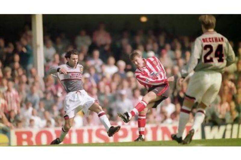 Southampton's Matthew Le Tissier takes a shot as Manchester United's Ryan Gigg makes a challenge during a league clash in April 1996, which the Saints won 3-1.