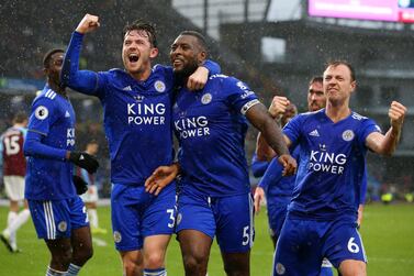 Wes Morgan, centre, celebrates with teammates after scoring Leicester City's winning goal against Burnley. Getty Images