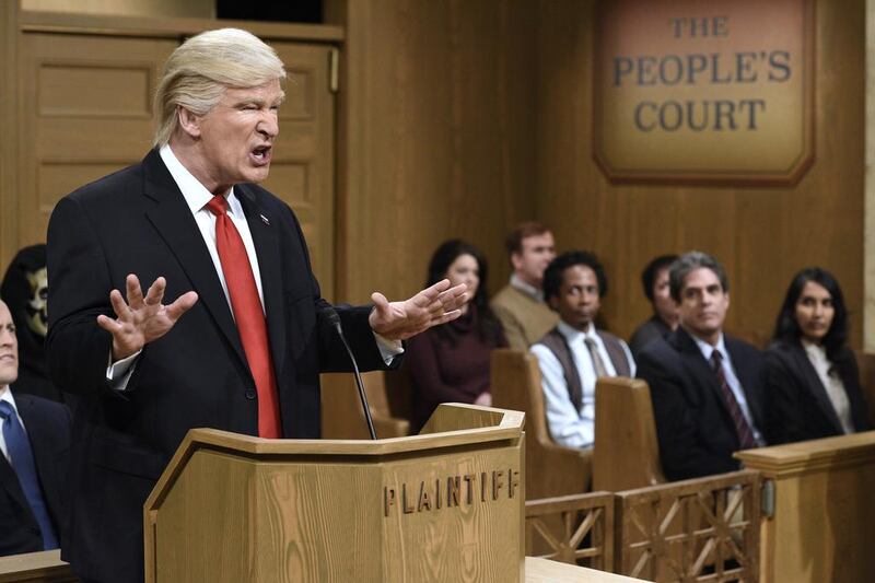 This Saturday, Feb. 11, 2017, image released by NBC shows host Alec Baldwin as President Donald Trump during the “Trump People’s Court” in New York. In his spoof, President Trump made good on a tweeted vow to “see you in court” directed at the three Ninth Circuit federal judges who refused to lift a stay preventing his immigration ban from being enforced. His chosen venue: “The People’s Court,” where he was suing the three judges. Will Heath / NBC via AP 