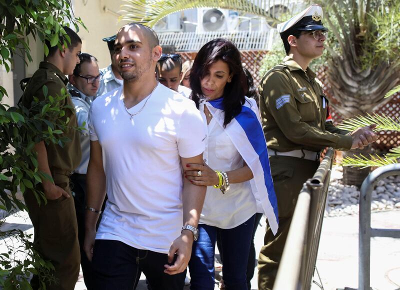 REFILE-ADDING INFORMATION Mother of former Israeli soldier Elor Azaria, who was convicted of manslaughter and sentenced to 18 months imprisonment for killing a wounded and incapacitated Palestinian assailant, arrives together with her son to hear the ruling at an Israeli military appeals court in Tel Aviv, Israel July 30, 2017. REUTERS/Dan Balilty/Pool