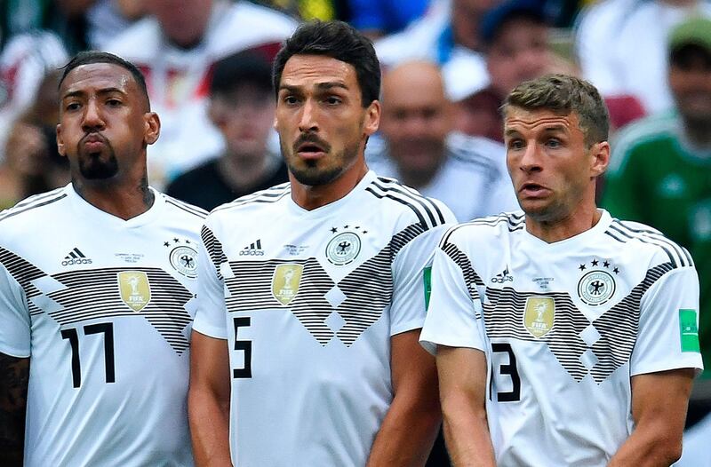 (L-R) Germany's defender Jerome Boateng, Germany's defender Mats Hummels and Germany's forward Thomas Mueller line up to make a wall during the Russia 2018 World Cup Group F football match between Germany and Mexico at the Luzhniki Stadium in Moscow. Germany head coach Joachim Loew dropped a bombshell on March 5, 2019 by announcing that 2014 World Cup winners Jerome Boateng, Mats Hummels and Thomas Mueller are no longer in his plans. - ALTERNATIVE CROP 
 / AFP / Kirill KUDRYAVTSEV / ALTERNATIVE CROP 

