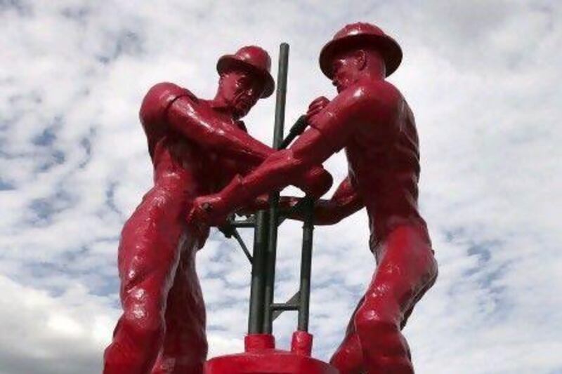 A statue honouring oil workers in Cabimas, Venezuela. The South American nation has been under-producing oil. Reuters