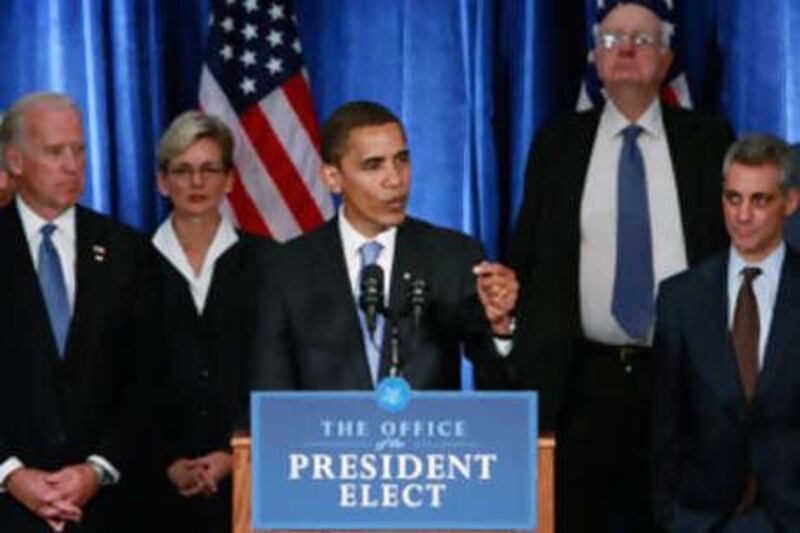 The President-elect Barack Obama holds his first post-election press conference at the Hilton Hotel flanked by his vice president-elect Joe Biden, left, his new chief of staff Rahm Emanuel, right, and members of his Transition Economic Advisory Board on Nov 7 2008 in Chicago, Illinois.