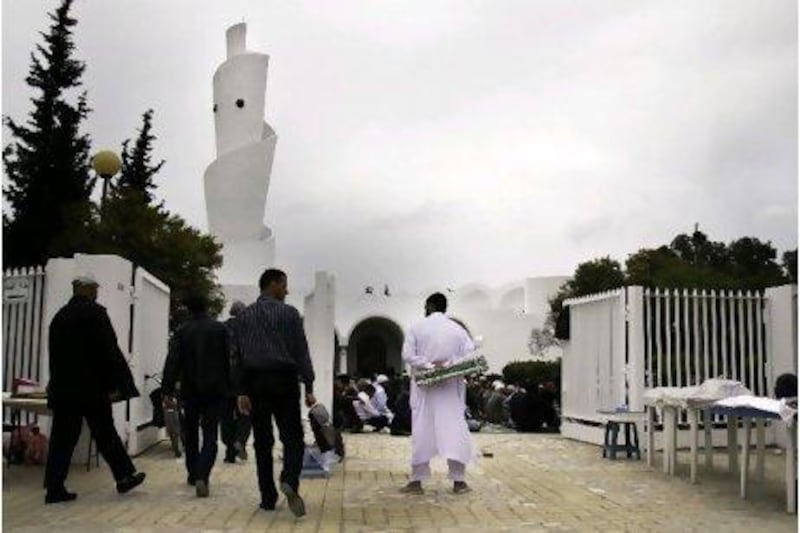 Men enter the mosque at Al Manar University for Friday prayers. Since Mr Ben Ali’s departure, conservative Muslims have taken to the streets to demand legal changes that would make it possible to live along what they consider more Islamic lines.