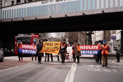 Insulate Britain supporters protest near Inner London Crown Court before the sentencing of campaigners Ruth Cook, Roman Paluch-Machnik, Stephen Pritchard and Oliver Rock. PA 