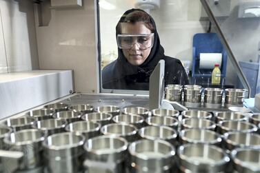 An Emirati woman scientist works in an aluminium labin Jebel Ali, Dubai. Chris Whiteoak / The National