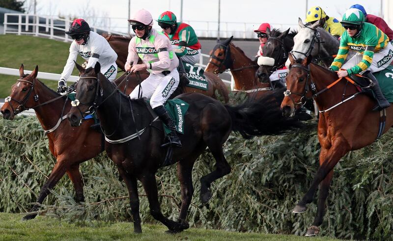 Competitors at the main race at the Grand National Festival in Aintree. EPA