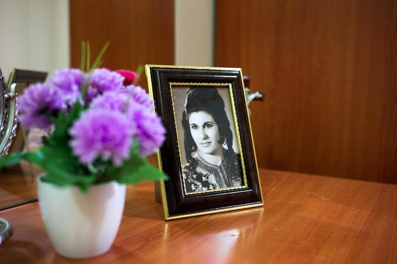 A portrait of Rita's mother sits in her bedroom.