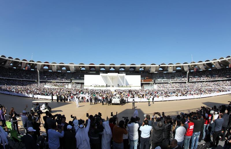 Pope Francis arrives to lead the mass at Zayed Sports City. EPA