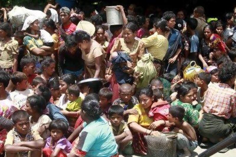 Muslim women and children from villages gather before being relocated to secure areas in Sittwe, the capital of the Rakhine state in western Myanmar, where sectarian violence is ongoing.