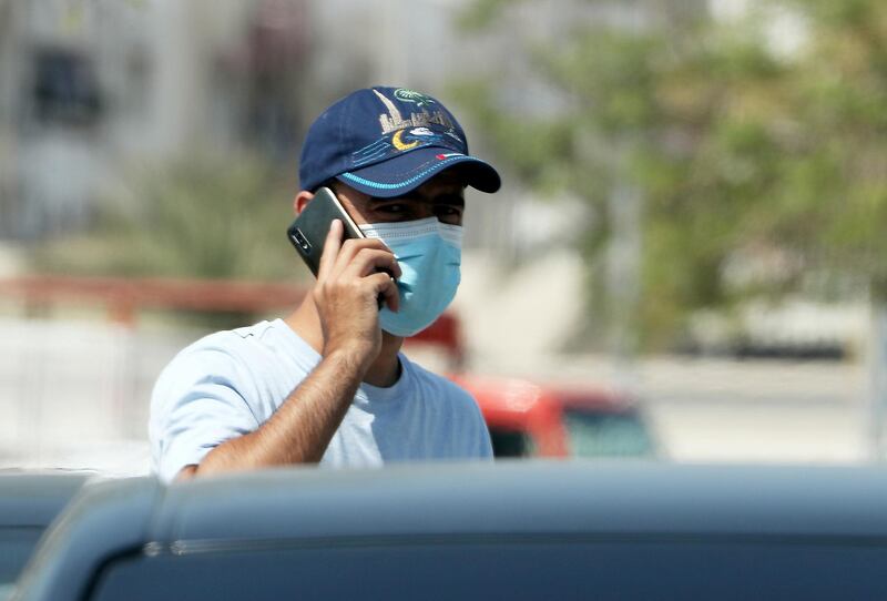 DUBAI, UNITED ARAB EMIRATES , October 3 – 2020 :- A person wearing protective face mask as a preventive measure against the spread of coronavirus in Al Karama area in Dubai. (Pawan Singh / The National) For News/Stock/Online.