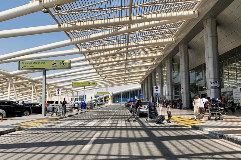 Travelers enter Terminal 3 at Cairo International Airport in Cairo, Egypt. Reuters