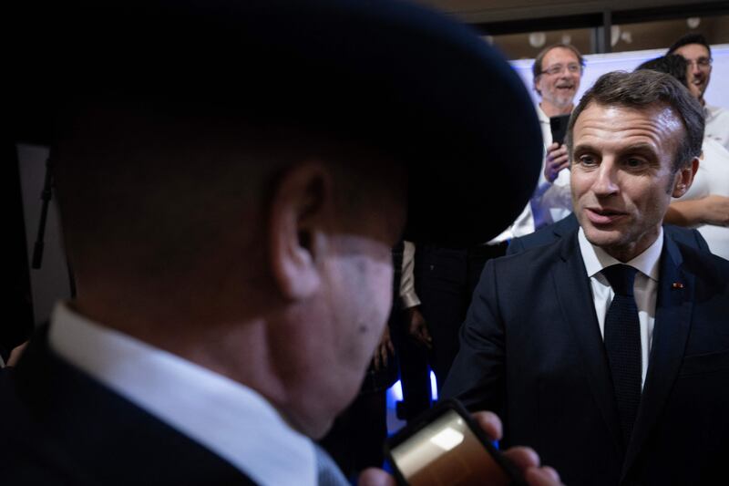 Mr Macron greets guests after speaking during a reception honouring the French community in the US at the French embassy in Washington. AFP