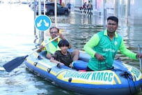 Volunteers use dinghys to float supplies to Sharjah residents almost a week after floods
