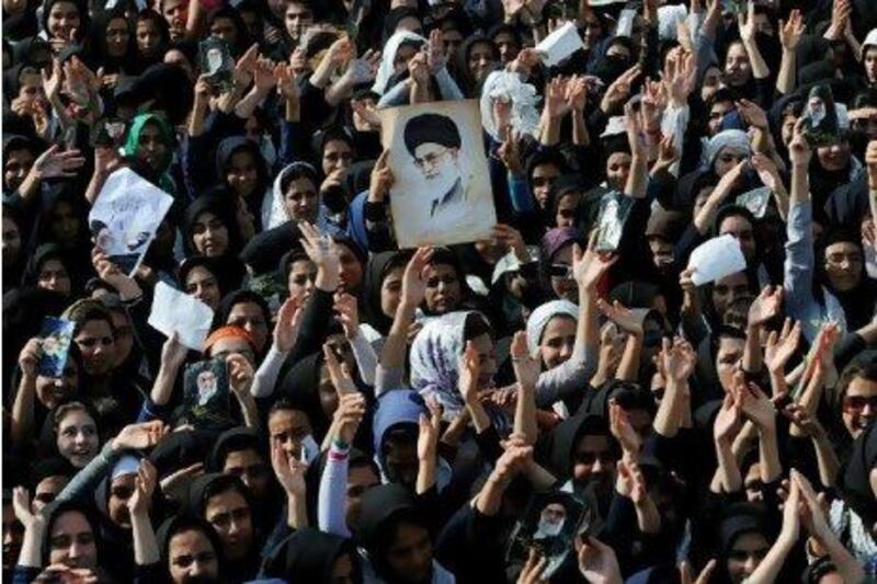 A crowd in Kermanshah province, west of Tehran, applauds a speech by Iran's Supreme Leader Ayatollah Ali Khamenei yesterday.