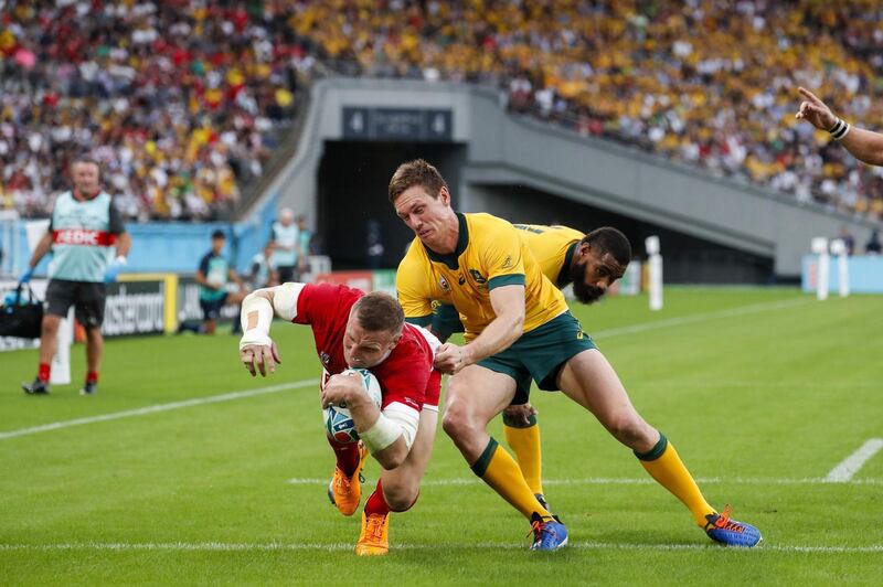 Wales scrum-half Gareth Davies scores a try  against Australia at the Tokyo Stadium. AFP