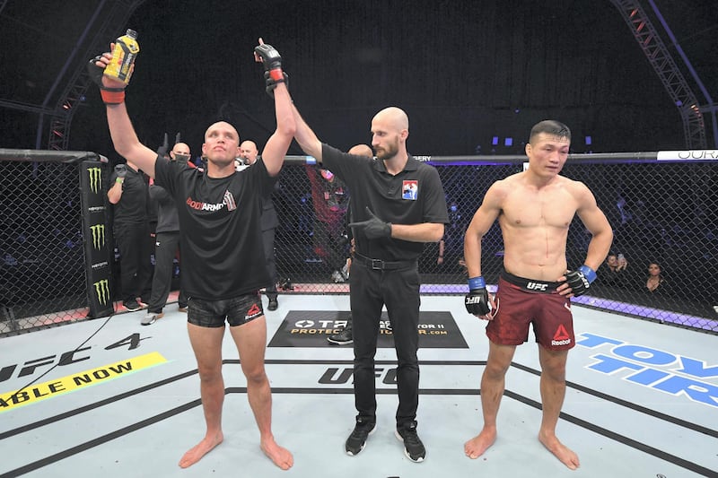 ABU DHABI, UNITED ARAB EMIRATES - OCTOBER 18:  (L-R) Brian Ortega celebrates his victory over ‚ÄòThe Korean Zombie‚Äô Chan Sung Jung in their featherweight bout during the UFC Fight Night event inside Flash Forum on UFC Fight Island on October 18, 2020 in Abu Dhabi, United Arab Emirates. (Photo by Josh Hedges/Zuffa LLC via Getty Images)
