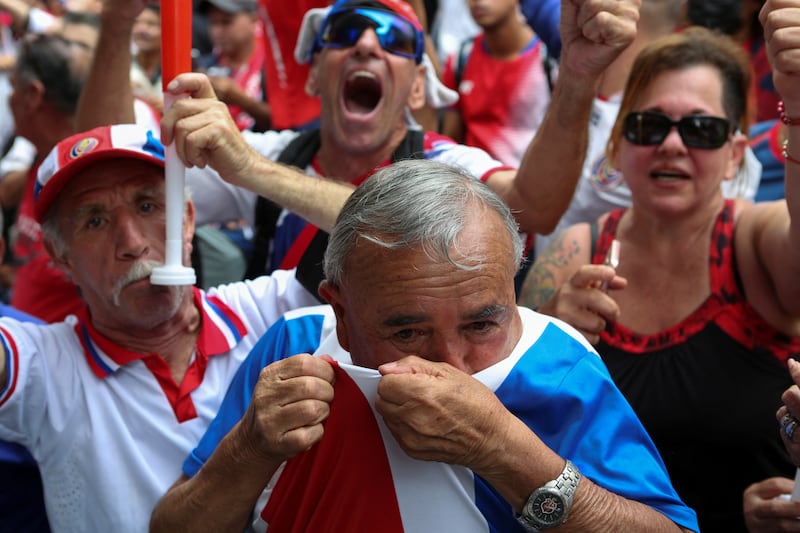 Costa Rica fans celebrate after watching the match. Reuters