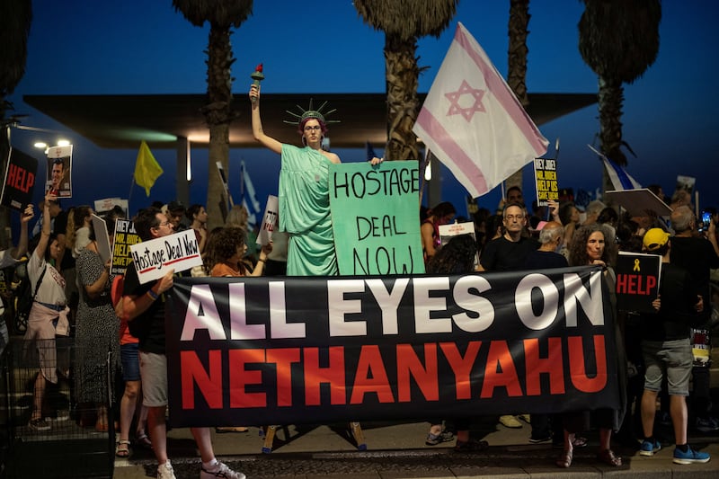 Protesters gather in Tel Aviv. Prime Minister Benjamin Netanyahu is at a political crossroads almost nine months into the Gaza war. Reuters