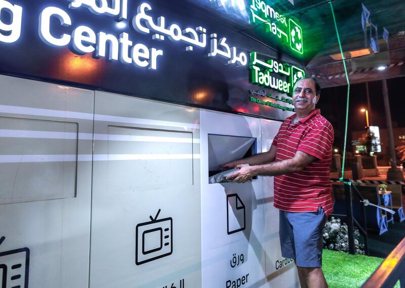 Abu Dhabi, U.A.E., July 3, 2018.   Mr. Sunil Thawani, 60, an Al Khalidiya resident does his part in recycling his trash during the opening of the first civic amenity in Abu Dhabi to promote waste segregation at source.  
Victor Besa / The National
Reporter - Haneen Dajani
Section:  NA