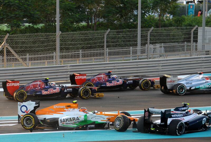 Williams' Brazilian driver Bruno Sena (bottom R) and Force India's German driver Nico Hulkenberg (bottom L) crash at the Yas Marina circuit, in Abu Dhabi, during the Abu Dhabi Formula One Grand Prix on November 4, 2012 . AFP PHOTO/TOM GANDOLFINI
 *** Local Caption ***  818564-01-08.jpg