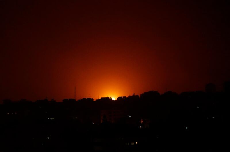 An explosion caused by Israeli airstrikes is seen on Gaza City, early Friday, March 15, 2019. Israeli warplanes attacked militant targets in the southern Gaza Strip early Friday in response to a rare rocket attack on the Israeli city of Tel Aviv, as the sides appeared to be hurtling toward a new round of violence. (AP Photo/Adel Hana)