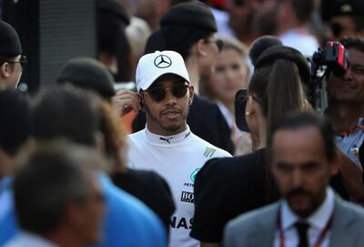 ABU DHABI, UNITED ARAB EMIRATES - NOVEMBER 26:  Lewis Hamilton of Great Britain and Mercedes GP looks on at the drivers parade before the Abu Dhabi Formula One Grand Prix at Yas Marina Circuit on November 26, 2017 in Abu Dhabi, United Arab Emirates.  (Photo by Clive Mason/Getty Images)