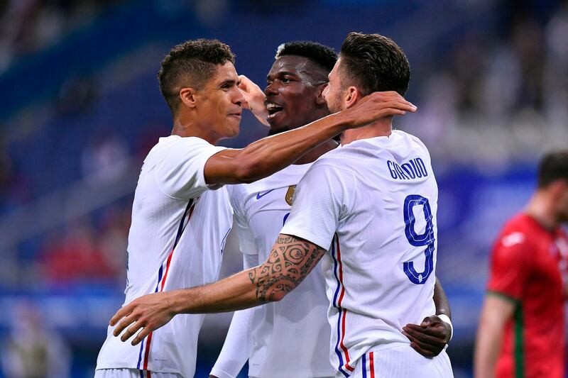 Olivier Giroud celebrates with Paul Pogba and Raphael Varane after scoring against Bulgaria. Getty Images