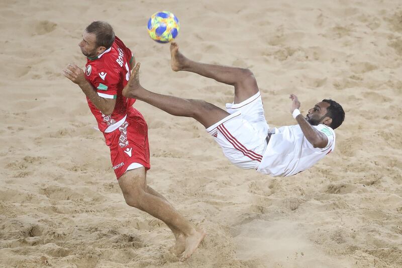 ASUNCION, PARAGUAY - NOVEMBER 22: Kamal Ali of United Arab Emirates UAE is challenged by Vadzim Bokach of Belarus during the FIFA Beach Soccer World Cup Paraguay 2019 group C match between Belarus and United Arab Emirates at Estadio Mundialista "Los Pynandi" on November 22, 2019 in Asuncion, Paraguay. (Photo by Alex Grimm - FIFA/FIFA via Getty Images) (Photo by Alex Grimm - FIFA/FIFA via Getty Images)