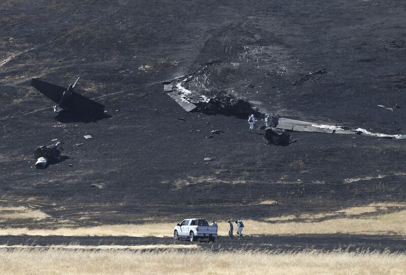 A US Air Force Hazmat team inspects the wreckage of the U-2 spy plane that crashed in the Sutter Butte mountains. Rich Pedroncelli / AP Photo
