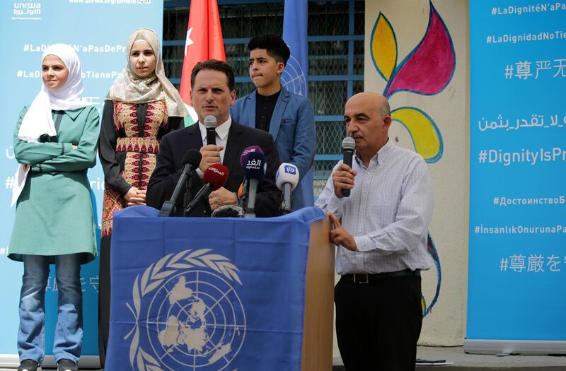 Pierre Kraehenbuehl, the Commissionner General of the United Nations Relief and Works Agency for Palestine Refugees in the Near East (UNRWA), stands  next to the UNRWA spokesman Sami Mushasha at an event marking Palestinian refugees first day back to school at the Amman New Camp. EPA