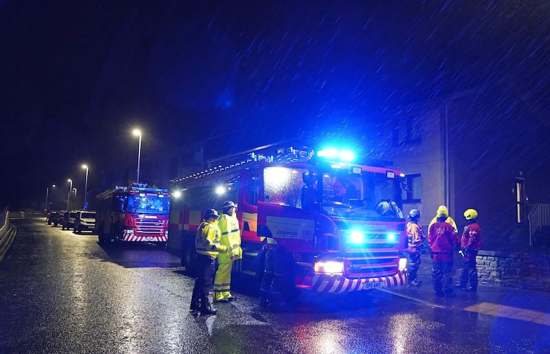 Emergency services in Brechin ask residents to leave their homes after flood warnings. PA